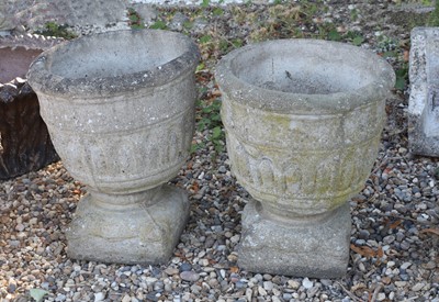 Lot 554 - A pair of composite urns