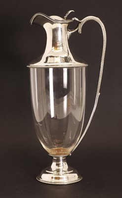 Lot 157 - A silver mounted clear glass claret jug