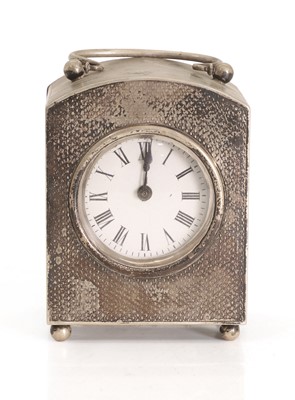 Lot 19 - A silver table clock