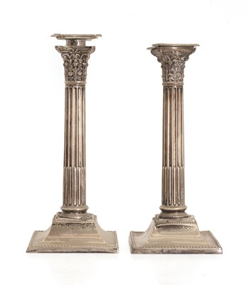 Lot 18 - A pair of silver candlesticks