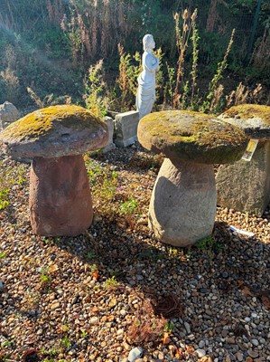 Lot 552 - A pair of carved sandstone staddle stones