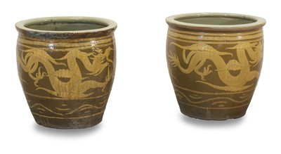Lot 511 - A pair of Chinese stoneware dragon bowls