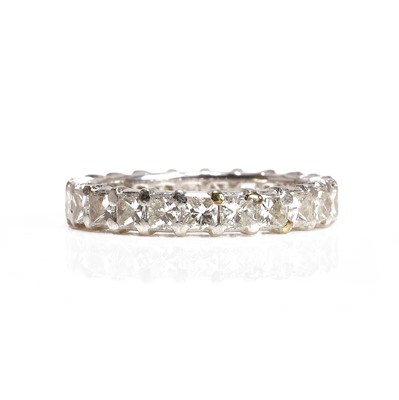 Lot 73 - A princess cut diamond eternity ring