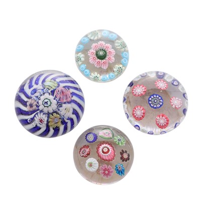 Lot 32 - A group of four miniature glass paperweights