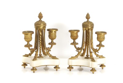 Lot 310 - A pair of Louis XVI-style gilt bronze and marble candlesticks