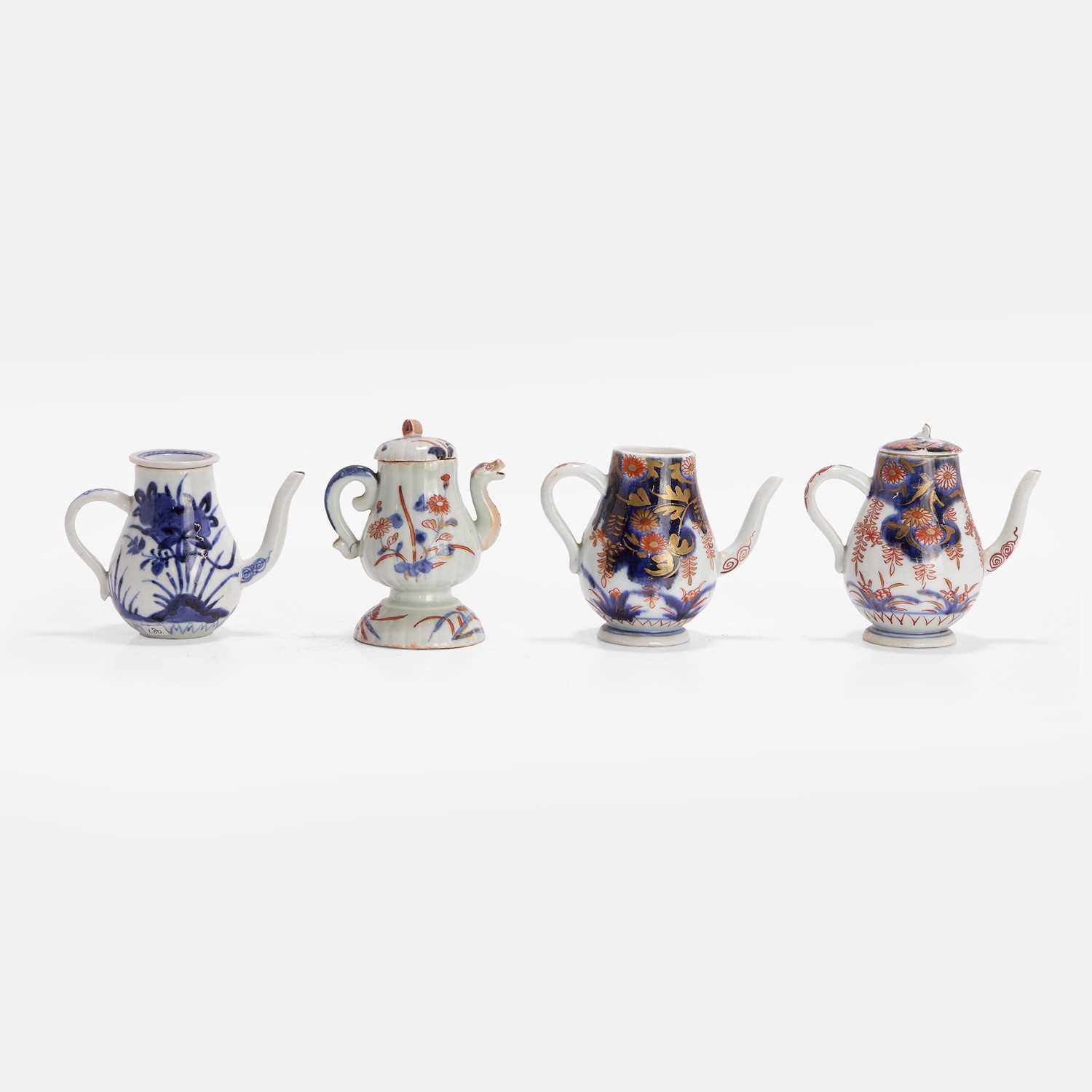Lot 434 - Three Japanese Arita condiment ewers,