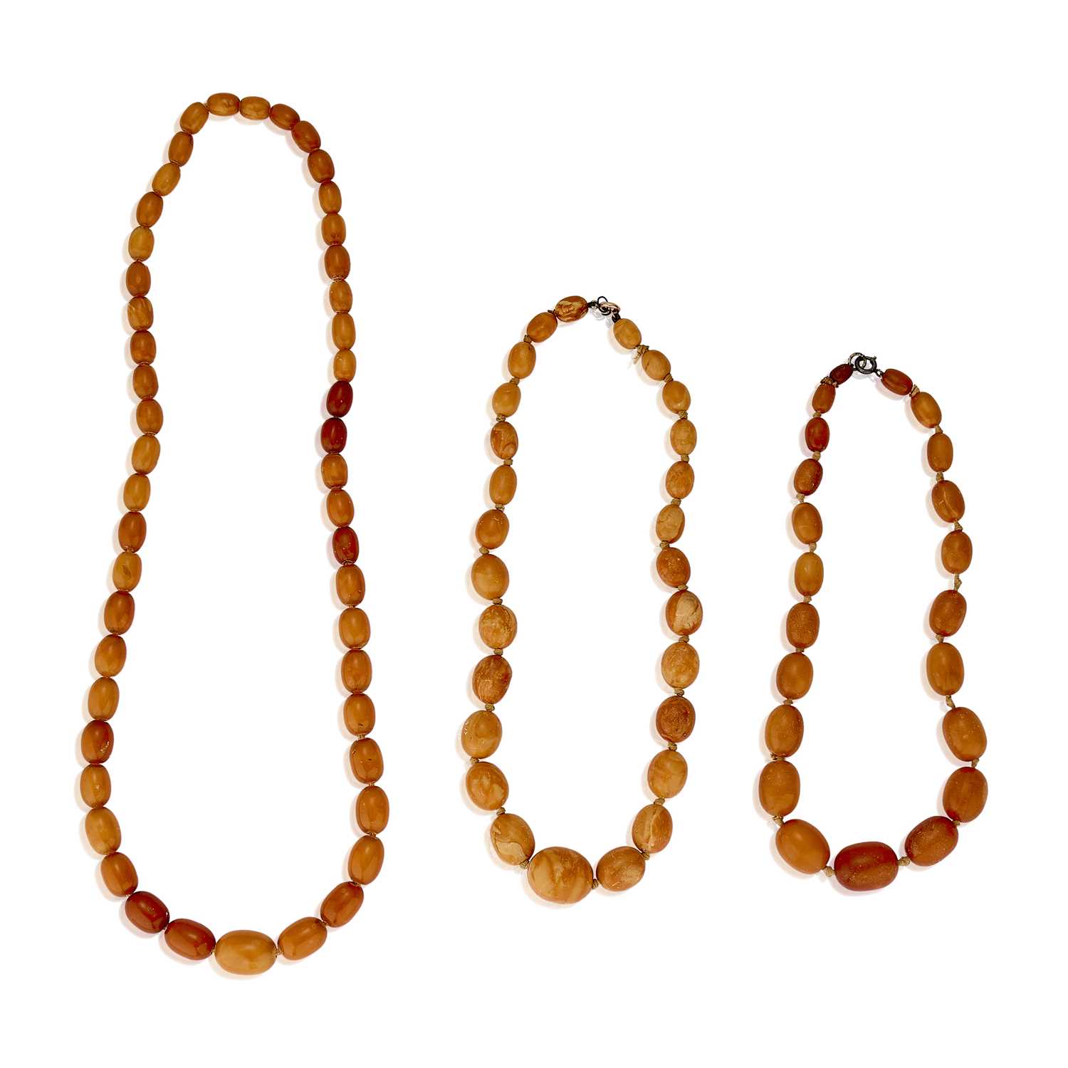 Lot 265 - A group of three amber bead necklaces