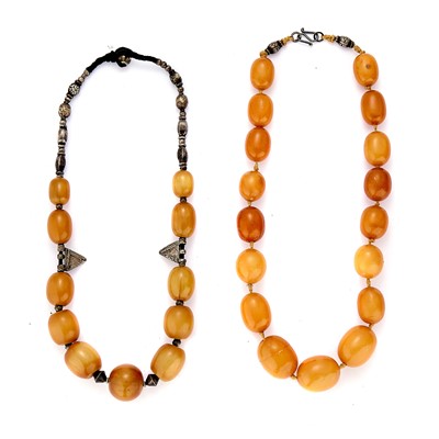 Lot 264 - An amber bead necklace and a simulated amber necklace