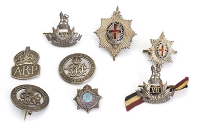 Lot 392 - Two Coldstream Guards silver and enamelled cap badges