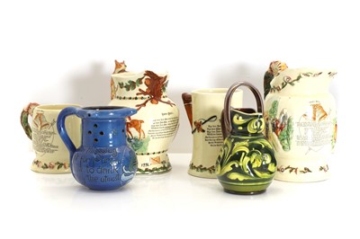Lot 123 - A C H Brannam blue glazed motto ware puzzle jug