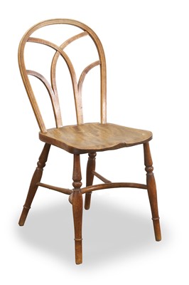 Lot 519 - An elm hoop back Windsor chair