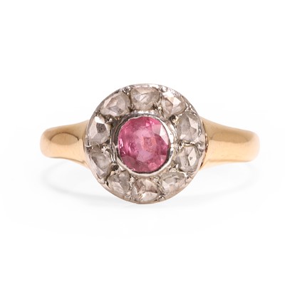 Lot 21 - A pink sapphire and diamond cluster ring