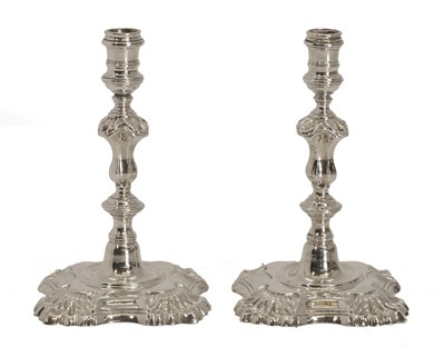 Lot 1 - A pair of small silver candlesticks
