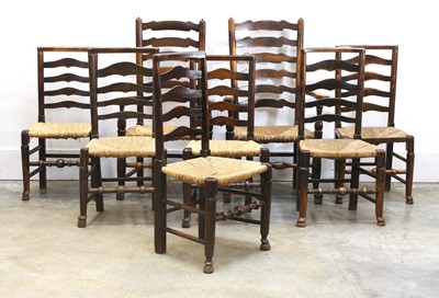 Lot 532 - A set of six George III country made ladder back chairs