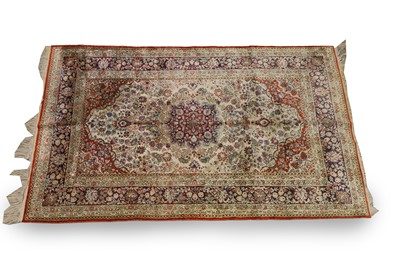 Lot 423 - A Persian silk rug