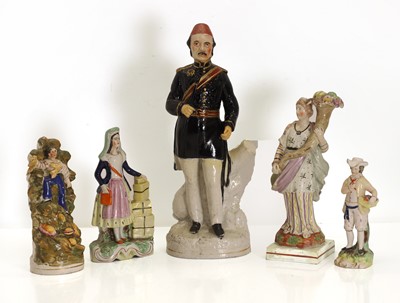 Lot 101 - A collection of five Staffordshire figurines