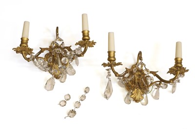 Lot 486 - A pair of gilt cast wall lights