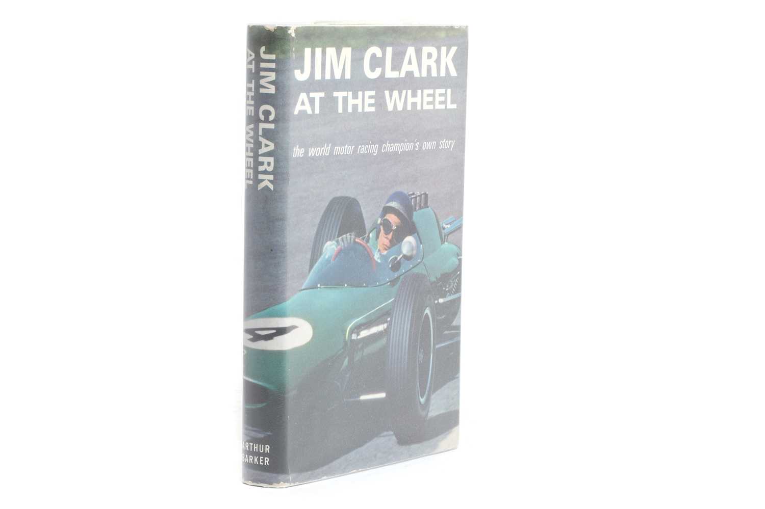 Lot 31 - CLARK, Jim (Signed): Jim Clark at the Wheel