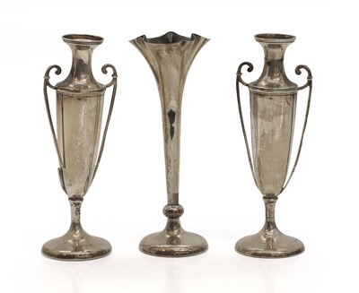 Lot 9 - A pair of silver urn shaped spill vases