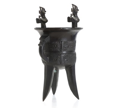 Lot 51 - A Chinese archaistic bronze jue tripod wine vessel