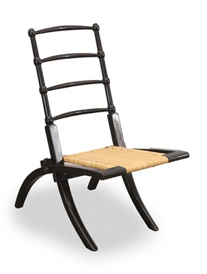 Lot 538 - An Aesthetic ebonised folding low chair