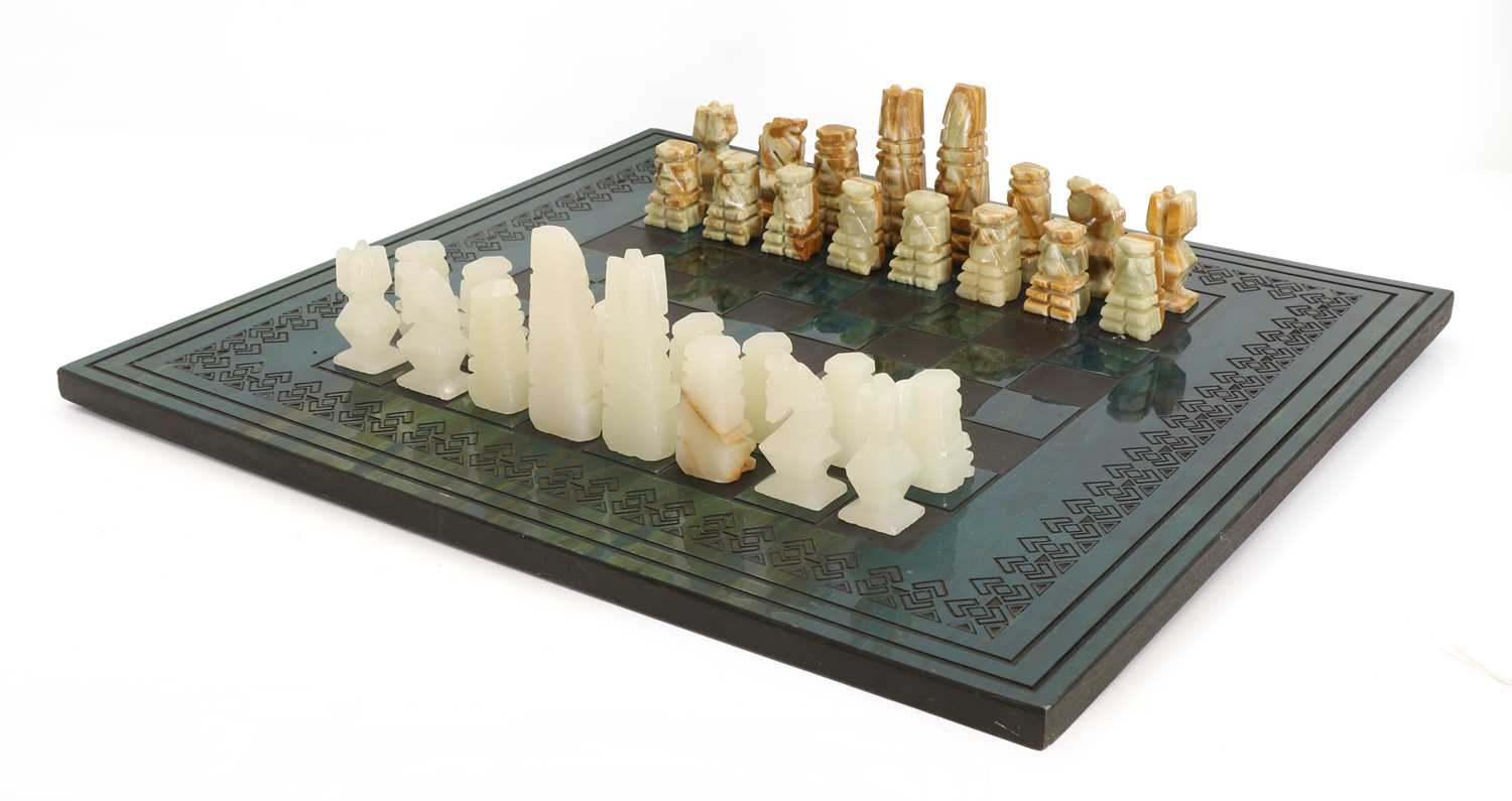 Lot 339 - An Aztec style calcite and onyx chess board