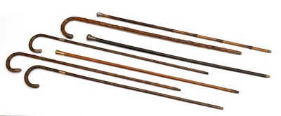 Lot 342 - A collection of silver-mounted walking canes