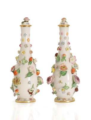 Lot 122 - A pair of Meissen encrusted porcelain vases and covers
