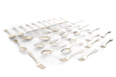 Lot 12 - A collection of George III and George IV matched silver fiddle pattern flatware