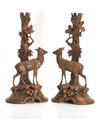 Lot 337 - A pair of Black Forest taper holders