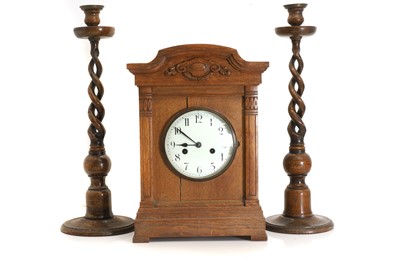 Lot 201 - A continental oak mantle clock