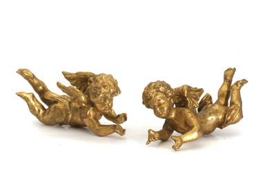 Lot 303 - A pair of carved and gilt cherubs