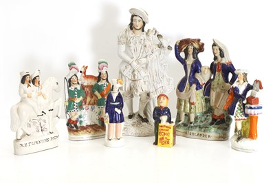 Lot 143 - A Staffordshire figure of a man wearing a blue coat