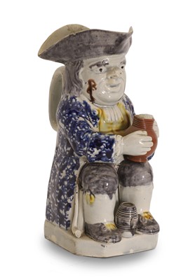 Lot 131 - A T J Hollins (Shelton) Staffordshire creamware Toby jug