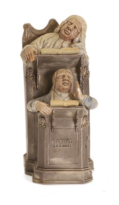 Lot 134 - A Staffordshire 'Vicar and Moses' group