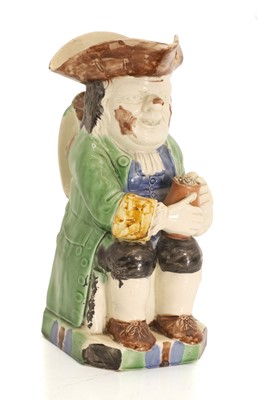 Lot 132 - A Whieldon type Toby jug
